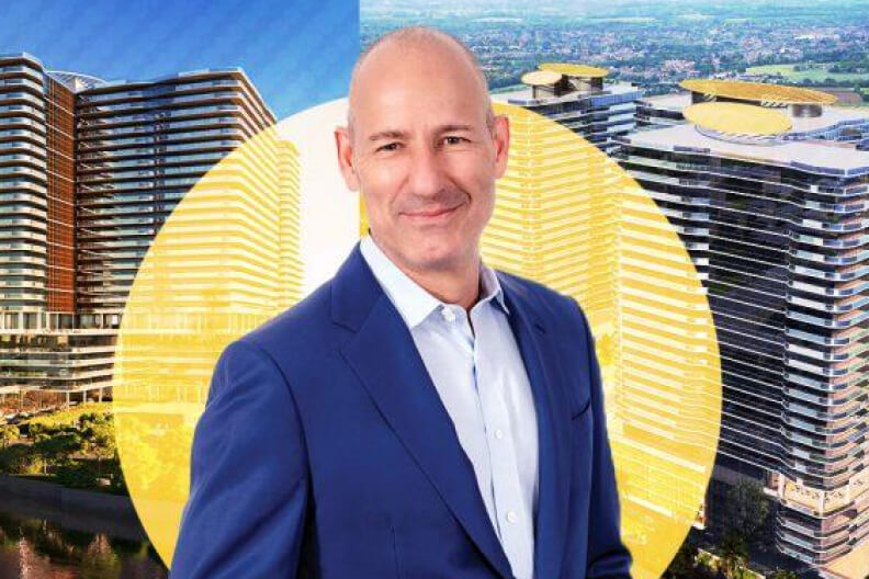 Christopher Schlank with Olara developments in the background