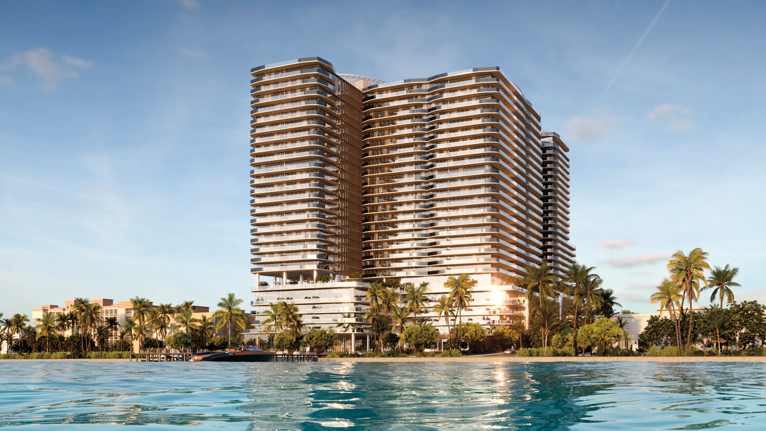 Low-angle waterfront view of Olara Residences, highlighting its stunning architecture and prime location in West Palm Beach.