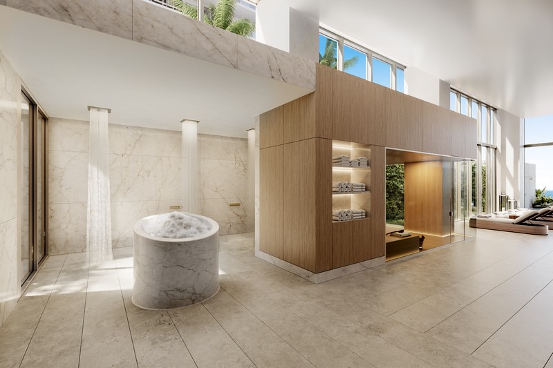 Luxurious spa at Olara Residences featuring spacious showers, plush towels, and a serene wellness atmosphere.