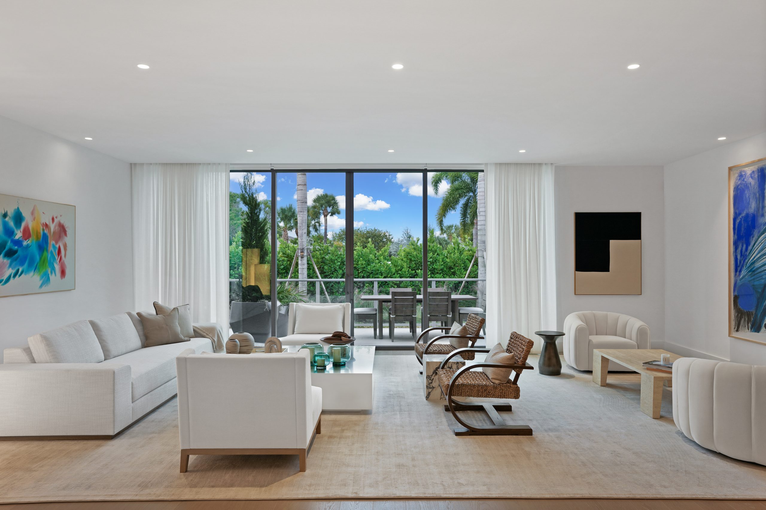 Elegant living room at Olara Residences featuring modern furnishings, luxurious design, and panoramic waterfront views.
