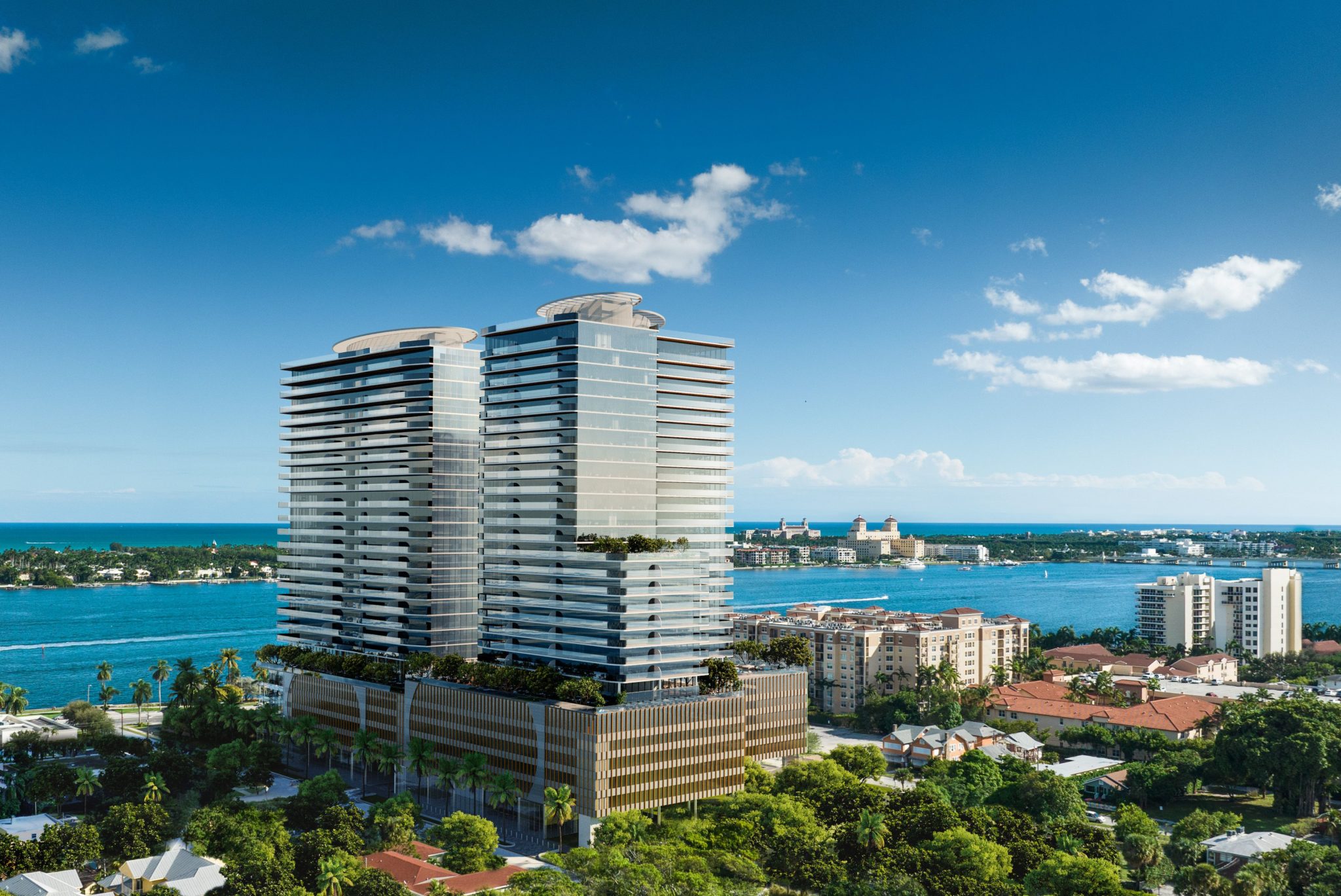 de aerial view of Olara Residences highlighting its waterfront location and architectural design.