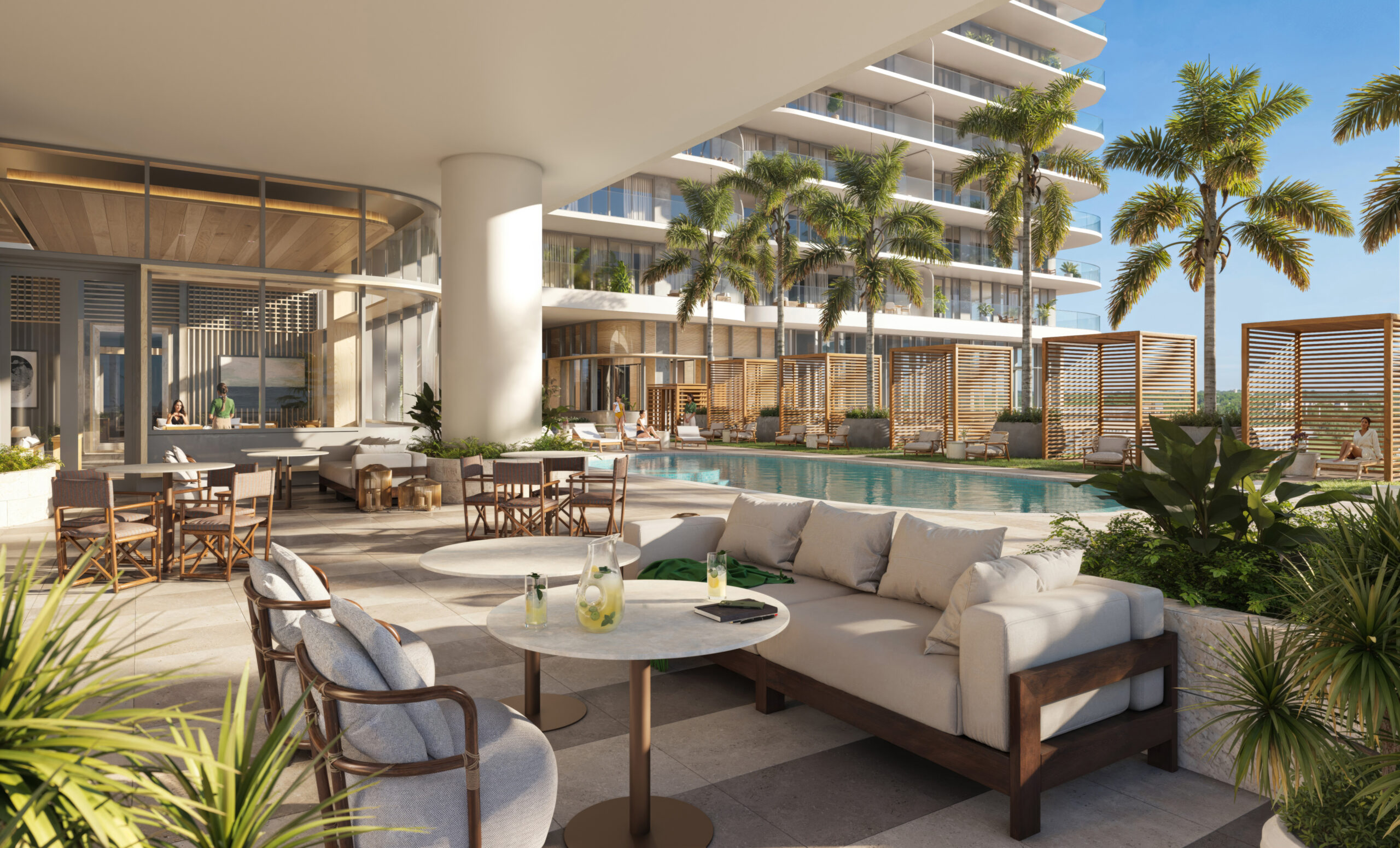 Elegant veranda at Olara Residences offering scenic waterfront views and luxurious outdoor seating.